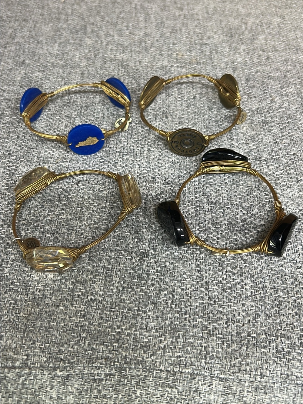 Bourbon and Bowties Gold Wire Bracelets with Blue, Black, and Clear Accents